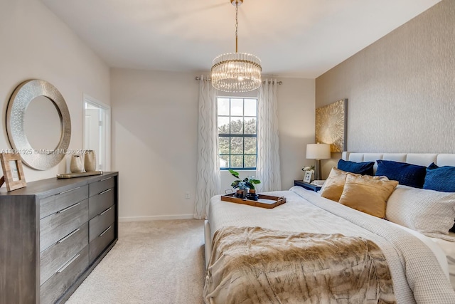 bedroom with an inviting chandelier and light colored carpet