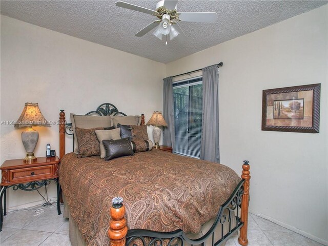 9549 NW 2nd Pl Unit 1-C, Coral Springs, FL 33071 - bedroom with light tile patterned floors, baseboards, ceiling fan, and a textured ceiling