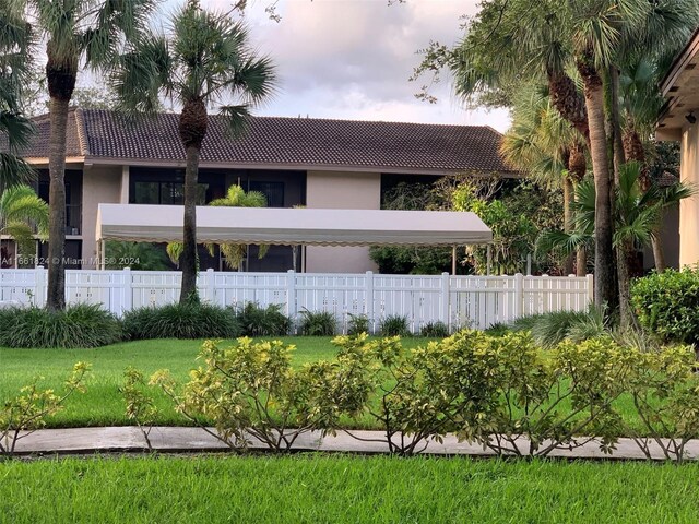 9549 NW 2nd Pl Unit 1-C, Coral Springs, FL 33071 - exterior space featuring fence, stucco siding, and a tiled roof