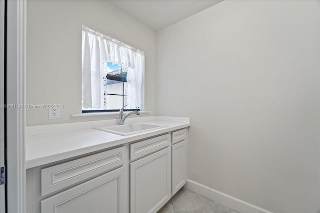 bathroom with vanity and tile patterned floors