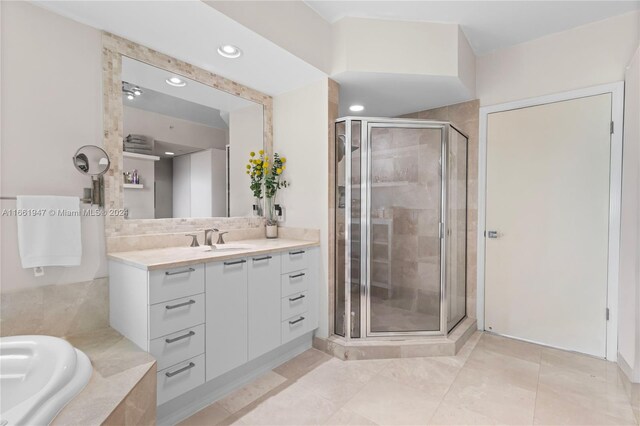 bathroom with vanity and plus walk in shower