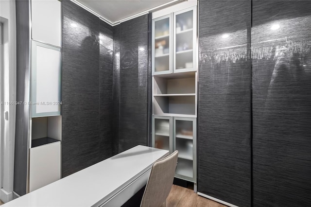 walk in closet featuring hardwood / wood-style flooring