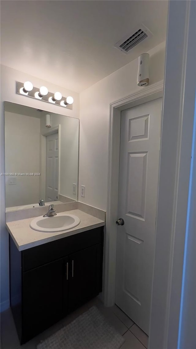 bathroom featuring vanity and tile patterned floors