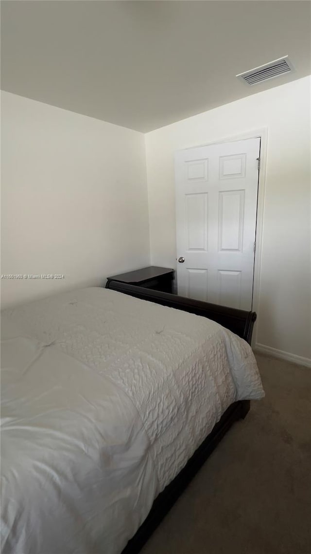 carpeted bedroom with a closet