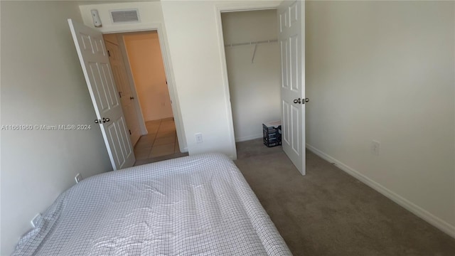 carpeted bedroom featuring a closet