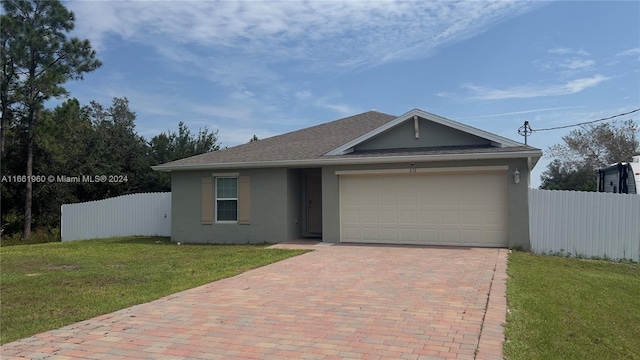 ranch-style home featuring a front yard and a garage