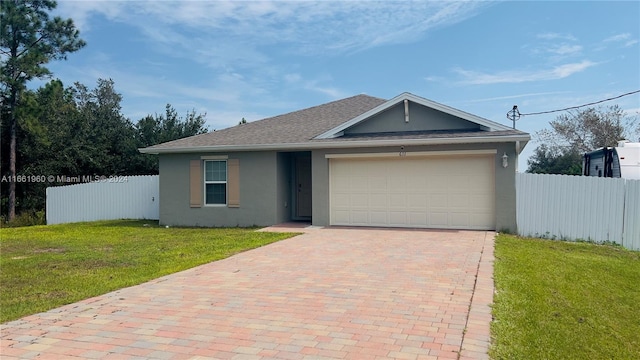 single story home featuring a front lawn and a garage