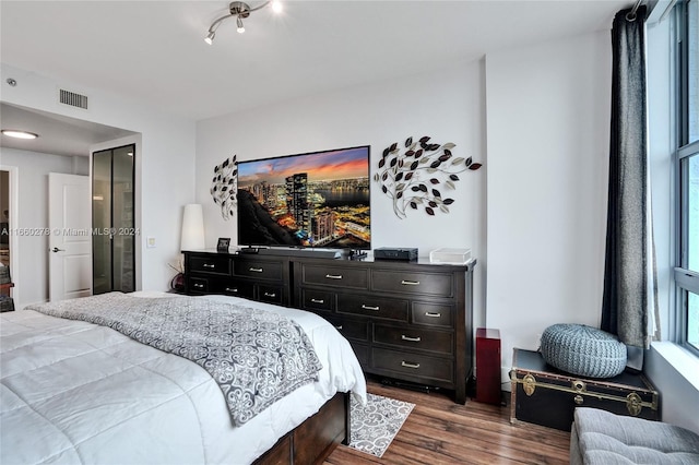 bedroom featuring hardwood / wood-style flooring