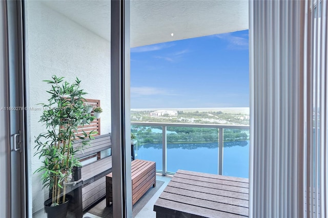 balcony featuring a water view