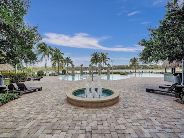 view of swimming pool featuring a water view