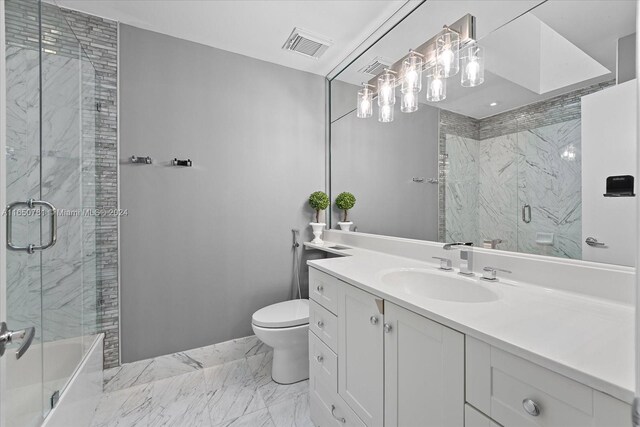 bathroom with vanity, toilet, and an enclosed shower