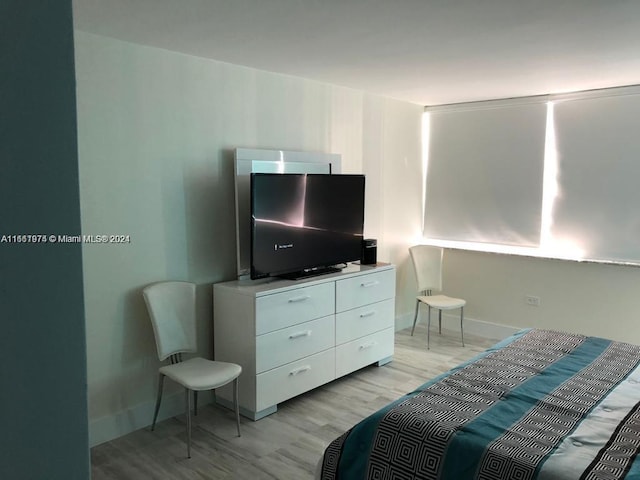 bedroom with light wood-type flooring