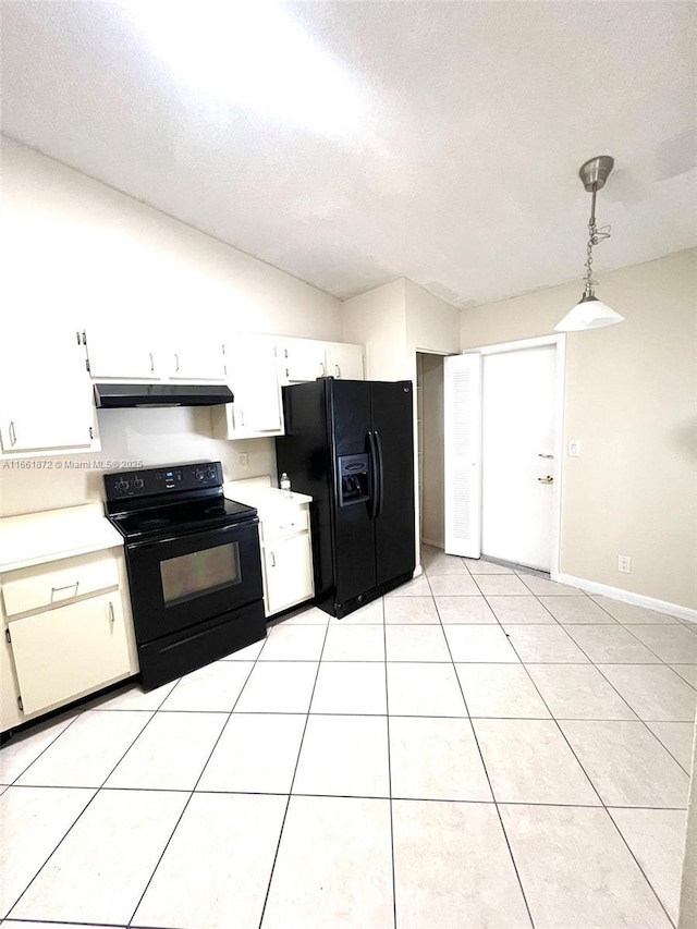 kitchen with white cabinets, lofted ceiling, decorative light fixtures, light tile patterned flooring, and black appliances