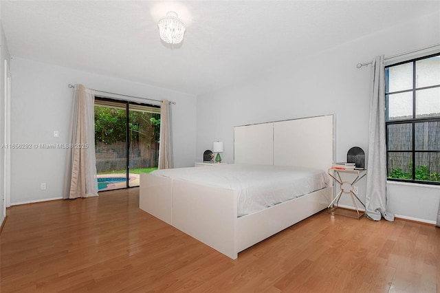11533 SW 59th Ct, Cooper City, FL 33330 - bedroom featuring access to outside and light wood-style flooring