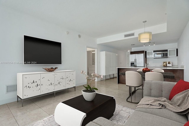 living room featuring light tile patterned flooring