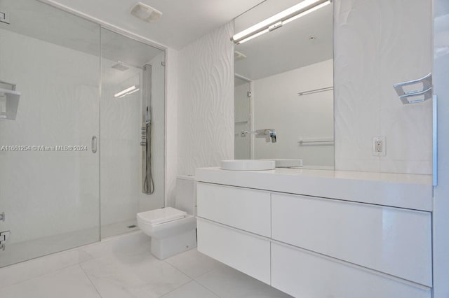 bathroom with tile patterned flooring, vanity, toilet, and an enclosed shower