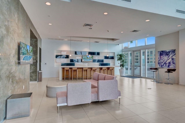 living room with light tile patterned flooring