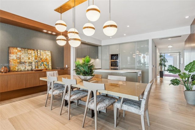 dining space featuring light hardwood / wood-style floors