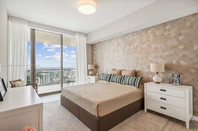 18975 Collins Ave Unit 4502, Sunny Isles Beach, FL 33160 - bedroom with access to outside and light wood-style flooring
