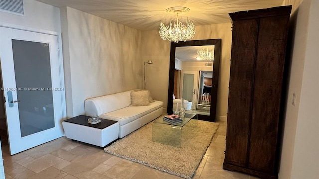 living room with a notable chandelier