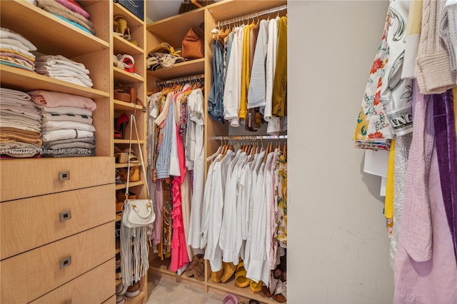 spacious closet featuring tile patterned flooring