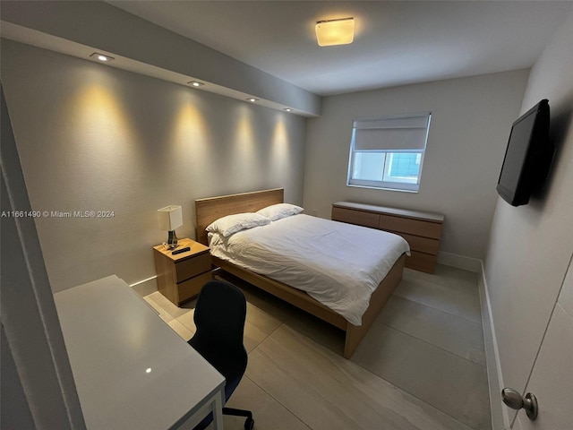 bedroom featuring light tile patterned flooring