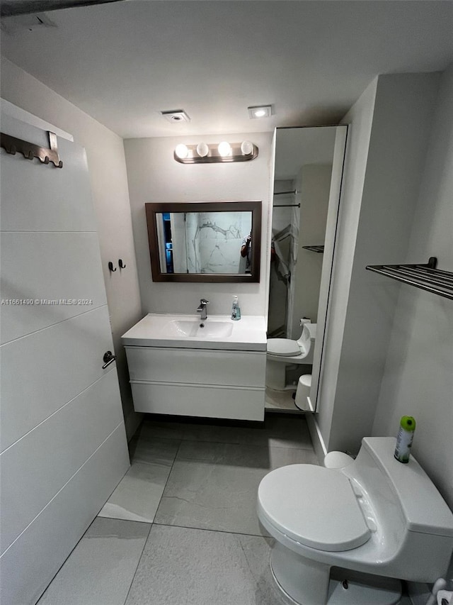 bathroom with vanity and toilet