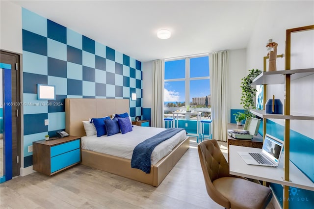 bedroom with light wood-type flooring