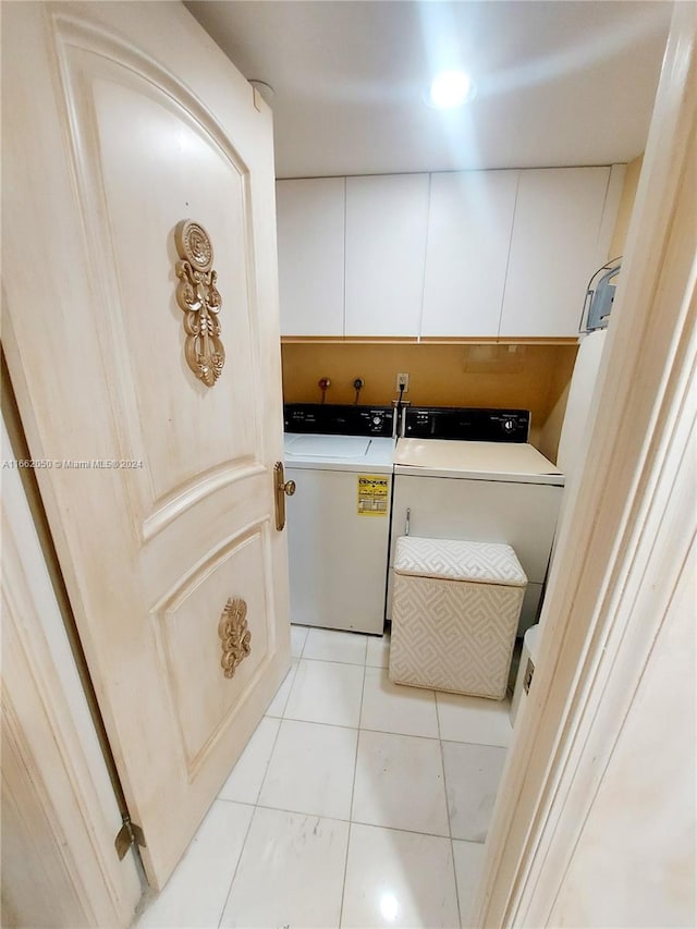 laundry area featuring cabinets and separate washer and dryer