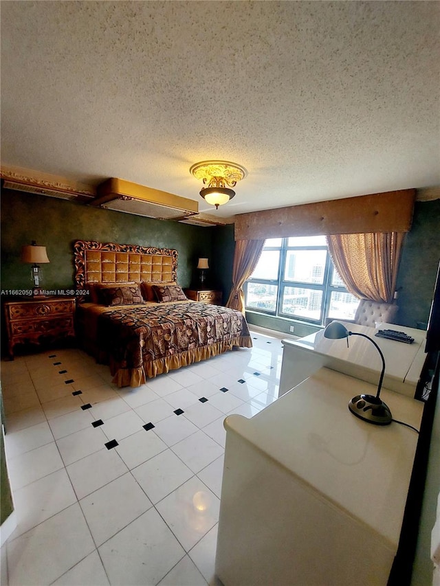 tiled bedroom with a textured ceiling