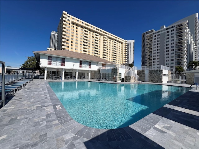 view of swimming pool with a patio area