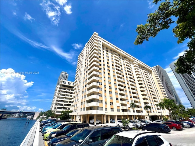 view of building exterior with a water view