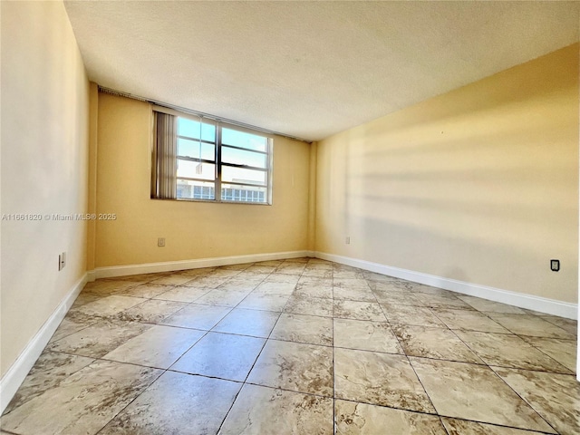 spare room featuring a textured ceiling