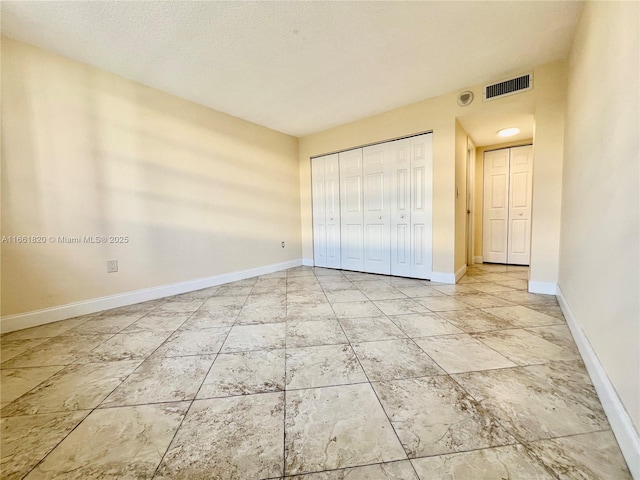 unfurnished bedroom with a closet