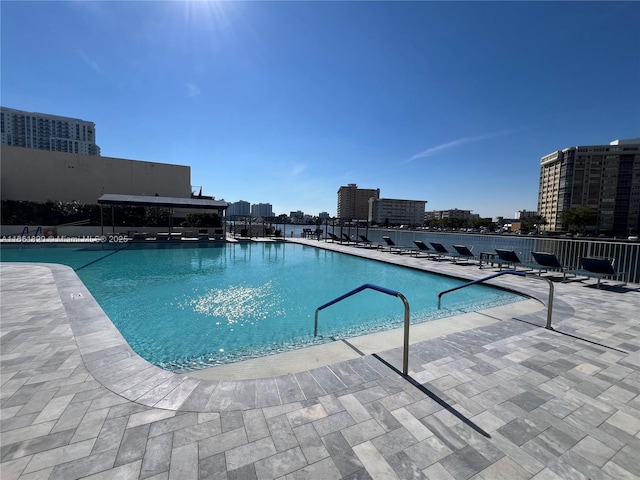 view of swimming pool featuring a patio area