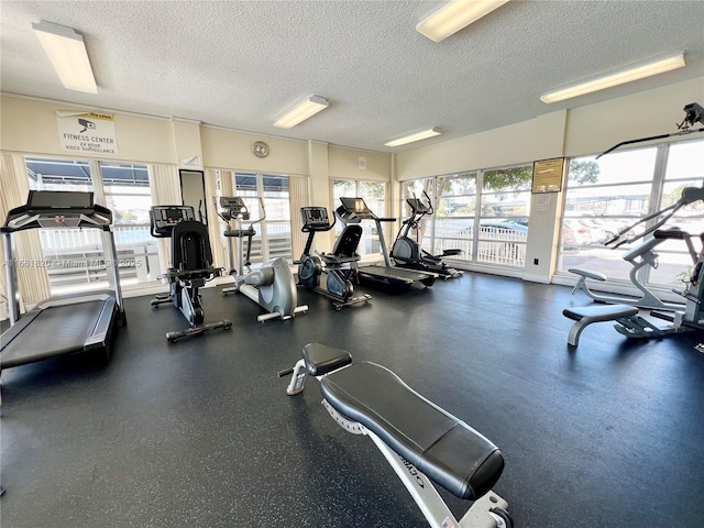 workout area featuring a textured ceiling