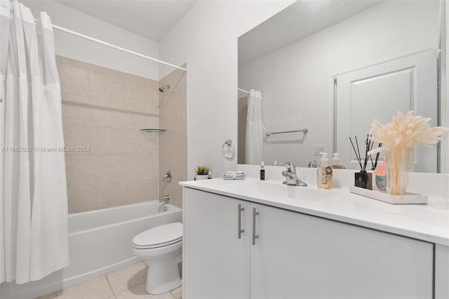 full bathroom featuring tile patterned flooring, vanity, toilet, and shower / bathtub combination with curtain