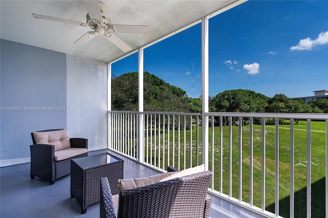 balcony featuring an outdoor living space and ceiling fan