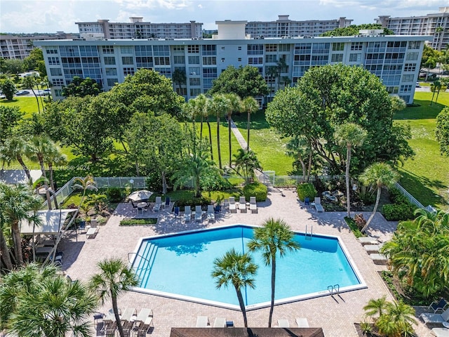 view of pool featuring a yard and a patio area