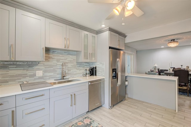 kitchen featuring ceiling fan, light hardwood / wood-style floors, stainless steel appliances, and sink