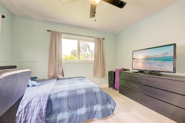 bedroom with light hardwood / wood-style flooring and ceiling fan