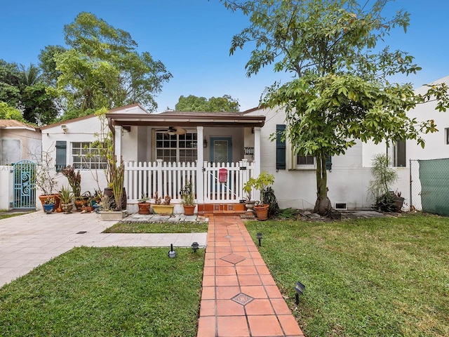 view of front of property with a porch and a front yard