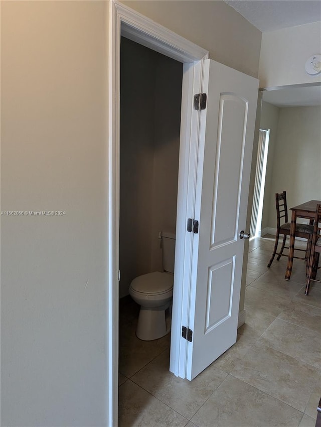 bathroom featuring tile patterned floors and toilet