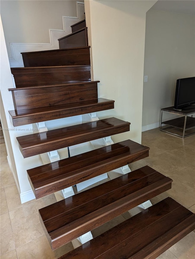 staircase with tile patterned flooring