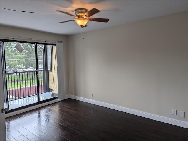 spare room with dark hardwood / wood-style floors, ceiling fan, and plenty of natural light