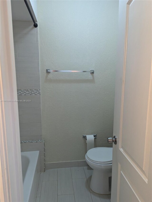 bathroom with toilet and plus walk in shower