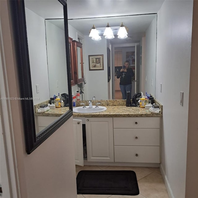 bathroom with tile patterned floors and vanity