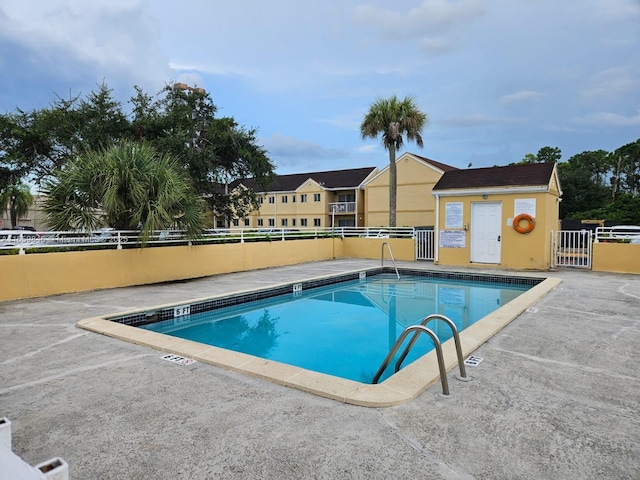 view of swimming pool with a patio