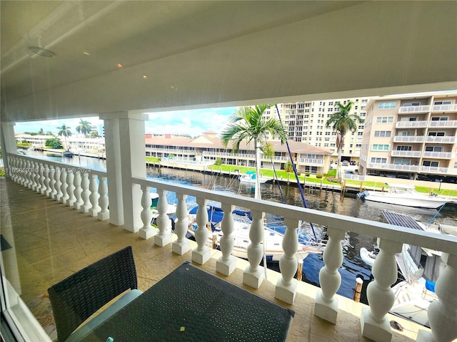 balcony featuring a water view