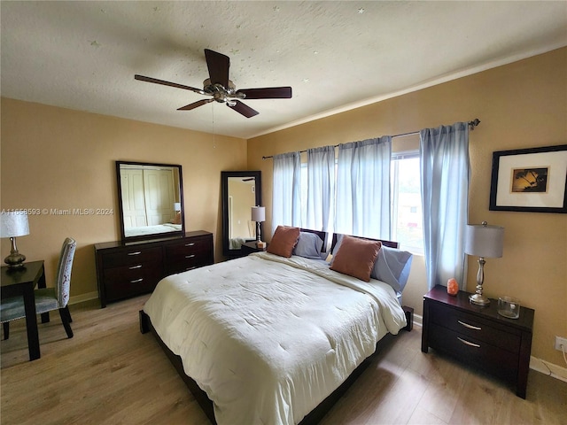 bedroom featuring ceiling fan and hardwood / wood-style flooring